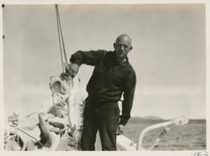 Image: Frank Henderson holding up a salmon